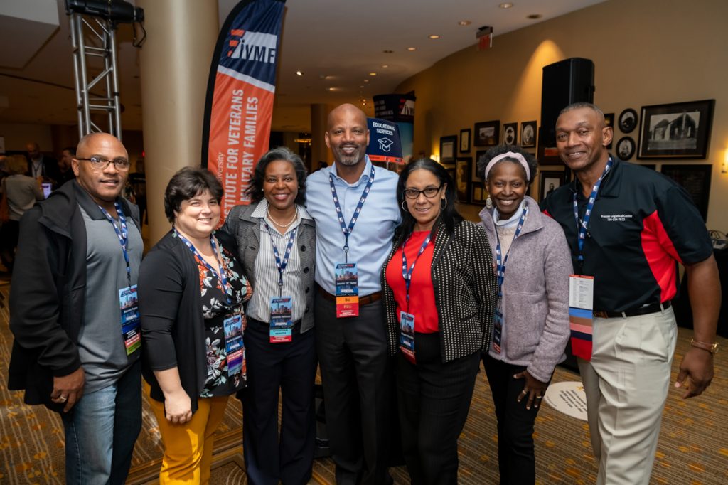 Group of people networking at Veteran EDGE conference. 